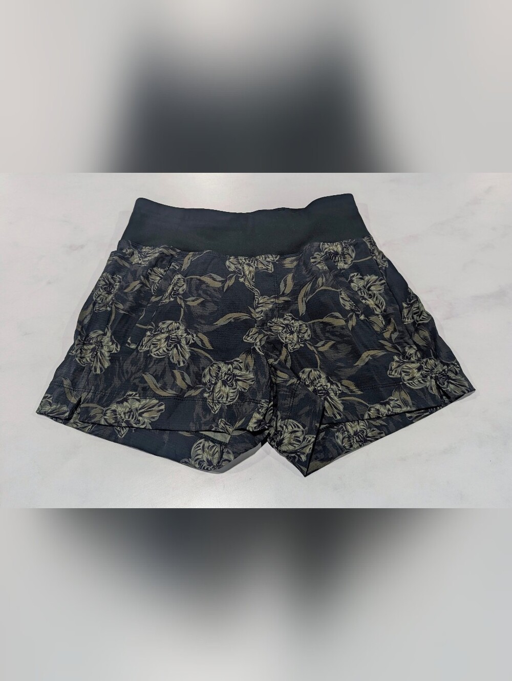 Athleta Dark Green Shorts with Beige Floral Print